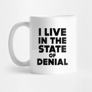 I Live in the State of Denial Mug